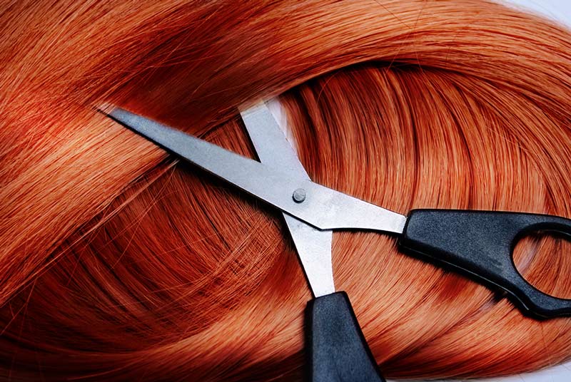 Red hair with scissors